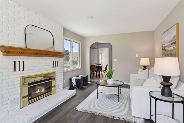 5917 Oliver Ave S, Minneapolis, MN 55419 - living area with arched walkways, wood finished floors, and a fireplace