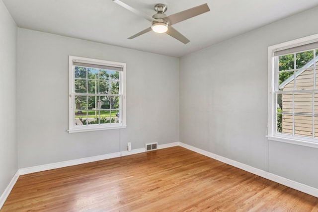 5917 Oliver Ave S, Minneapolis, MN 55419 - unfurnished room featuring plenty of natural light, light wood finished floors, and a ceiling fan