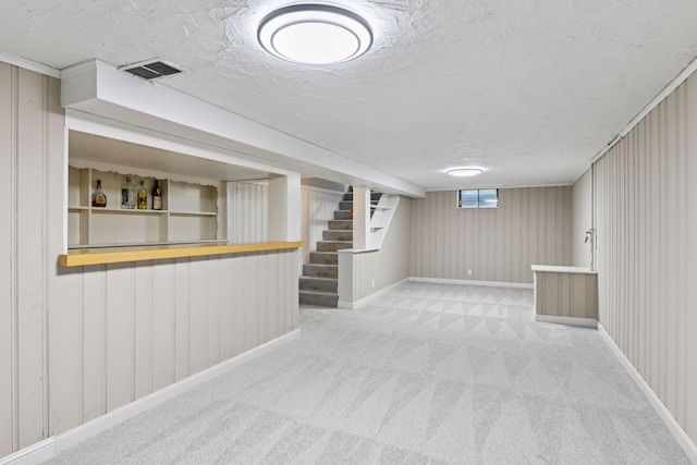 5917 Oliver Ave S, Minneapolis, MN 55419 - below grade area featuring carpet, stairs, and a textured ceiling