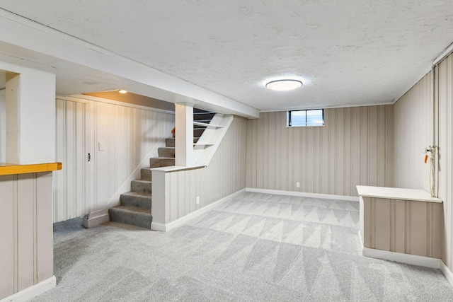 5917 Oliver Ave S, Minneapolis, MN 55419 - basement featuring stairs, carpet flooring, and a textured ceiling