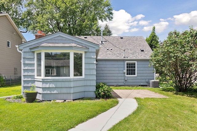 5917 Oliver Ave S, Minneapolis, MN 55419 - rear view of house with roof with shingles and a patio
