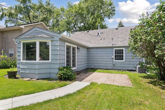 5917 Oliver Ave S, Minneapolis, MN 55419 - back of property featuring a patio, a lawn, and a shingled roof