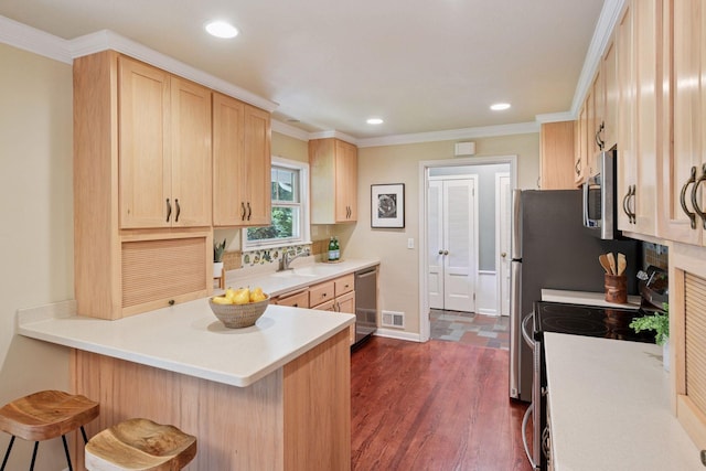 3918 Willmatt Hl, Minnetonka, MN 55305 - kitchen with appliances with stainless steel finishes, light brown cabinetry, a peninsula, dark wood-type flooring, and a breakfast bar area