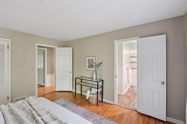 3918 Willmatt Hl, Minnetonka, MN 55305 - bedroom with light wood-style flooring and ensuite bath