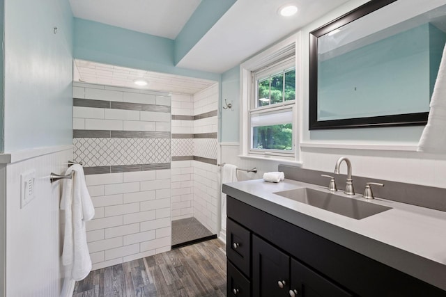 3918 Willmatt Hl, Minnetonka, MN 55305 - full bath with vanity, a wainscoted wall, a walk in shower, and wood finished floors