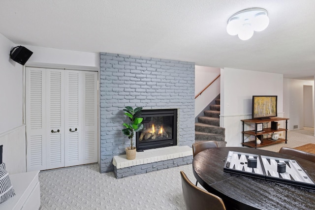 3918 Willmatt Hl, Minnetonka, MN 55305 - living area featuring a fireplace, carpet flooring, and stairway