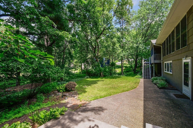 3918 Willmatt Hl, Minnetonka, MN 55305 - view of green lawn featuring stairs and a patio area