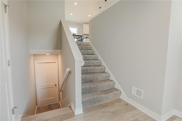 6006 Fuller Cir, Wyoming, MN 55092 - stairs featuring wood finished floors and recessed lighting