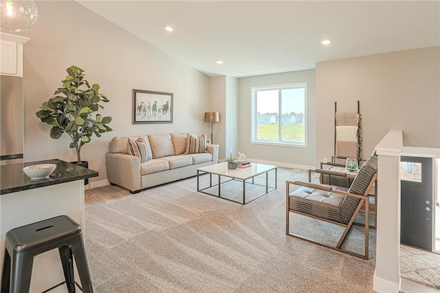 6006 Fuller Cir, Wyoming, MN 55092 - living room featuring light colored carpet, recessed lighting, and lofted ceiling