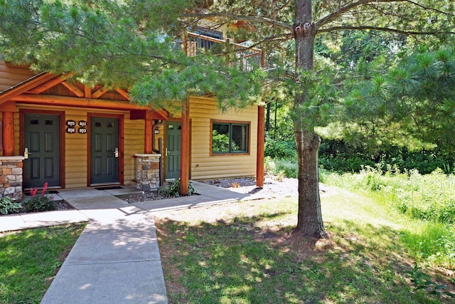 24909 Sandy Ln, Bay Lake Twp, MN 56444 - view of front facade with faux log siding and a porch