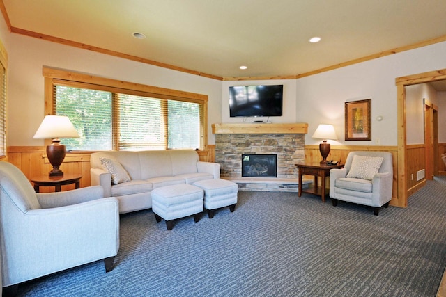 24909 Sandy Ln, Bay Lake Twp, MN 56444 - carpeted living area featuring wainscoting, wooden walls, a fireplace, recessed lighting, and ornamental molding
