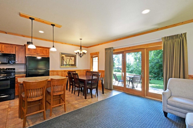 24909 Sandy Ln, Bay Lake Twp, MN 56444 - dining space with a wainscoted wall, a chandelier, recessed lighting, and wood walls