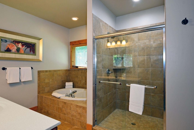 24909 Sandy Ln, Bay Lake Twp, MN 56444 - bathroom featuring vanity, a garden tub, a stall shower, and recessed lighting