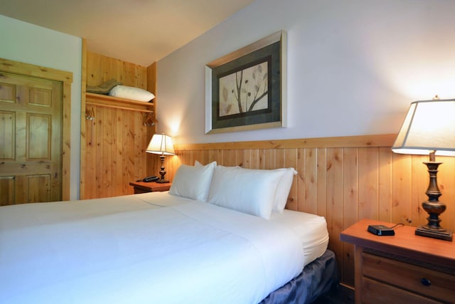 24909 Sandy Ln, Bay Lake Twp, MN 56444 - bedroom with wooden walls and wainscoting