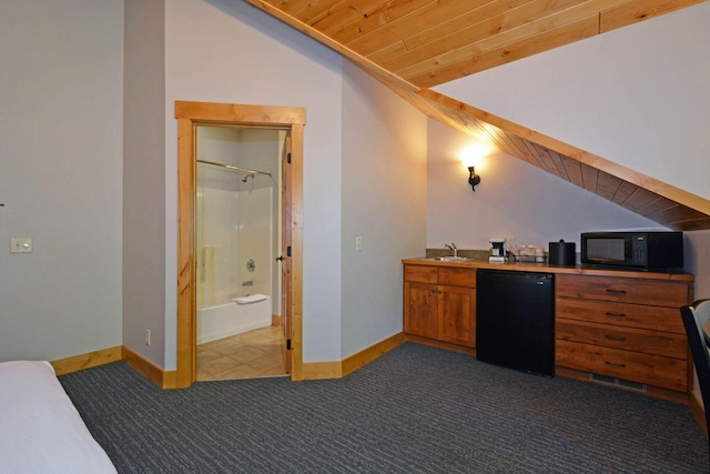 24909 Sandy Ln, Bay Lake Twp, MN 56444 - home office featuring dark colored carpet, lofted ceiling, and wooden ceiling
