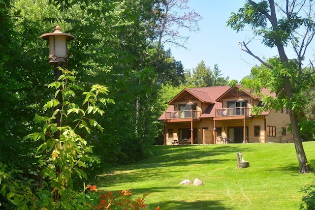 24909 Sandy Ln, Bay Lake Twp, MN 56444 - back of property with a yard and a balcony