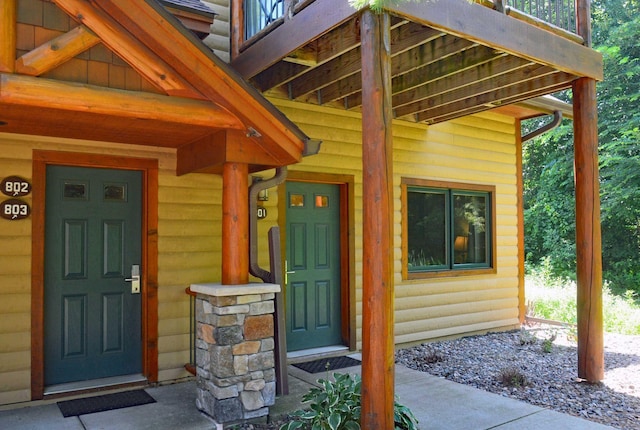 24909 Sandy Ln, Bay Lake Twp, MN 56444 - doorway to property featuring log veneer siding