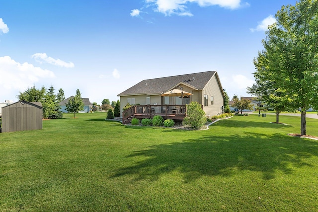 511 8th St SW, Rice, MN 56367 - back of property with a shed, a deck, a lawn, and roof with shingles