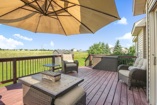 511 8th St SW, Rice, MN 56367 - wooden terrace featuring a lawn and an outdoor fire pit