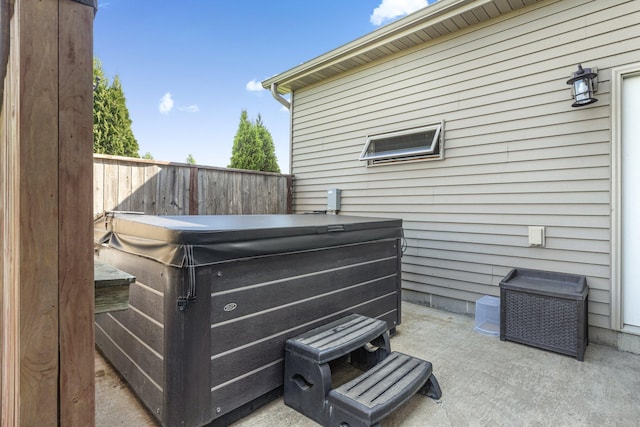 511 8th St SW, Rice, MN 56367 - view of patio / terrace featuring a hot tub