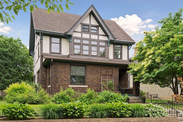 1088 Lincoln Ave, Saint Paul, MN 55105 - tudor home with stucco siding, roof with shingles, and brick siding