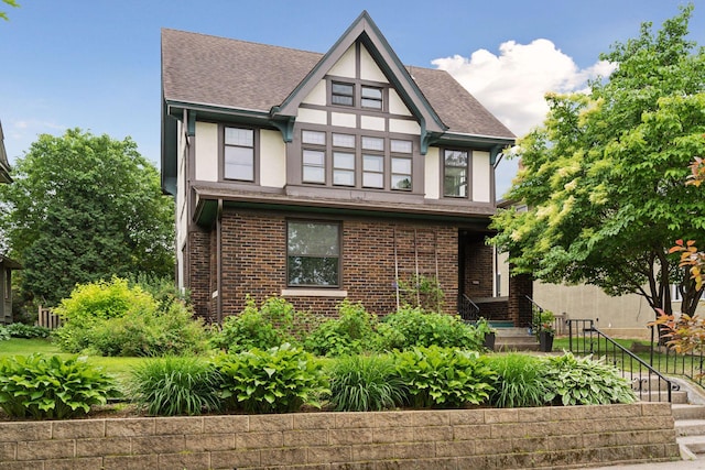 1088 Lincoln Ave, Saint Paul, MN 55105 - english style home with stucco siding, a shingled roof, and brick siding
