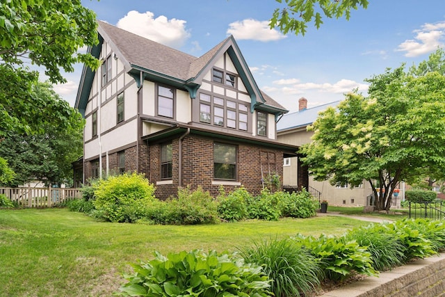 1088 Lincoln Ave, Saint Paul, MN 55105 - view of property exterior featuring stucco siding, a shingled roof, and brick siding