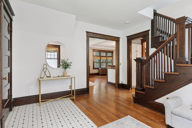 1088 Lincoln Ave, Saint Paul, MN 55105 - entryway featuring radiator, wood finished floors, and stairs