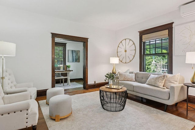 1088 Lincoln Ave, Saint Paul, MN 55105 - living room featuring an AC wall unit and wood finished floors