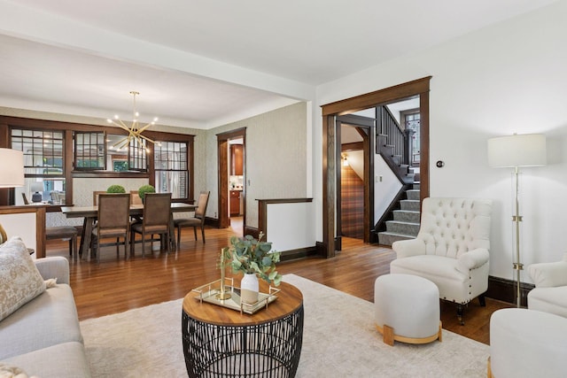 1088 Lincoln Ave, Saint Paul, MN 55105 - living area with a chandelier, stairs, and wood finished floors