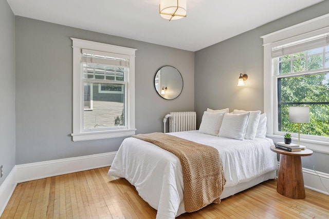 1088 Lincoln Ave, Saint Paul, MN 55105 - bedroom featuring radiator heating unit and light wood finished floors