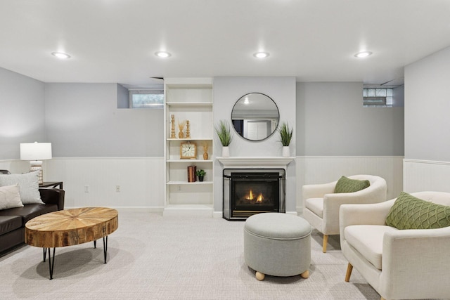 1088 Lincoln Ave, Saint Paul, MN 55105 - carpeted living room featuring a wainscoted wall, recessed lighting, and a lit fireplace