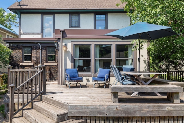 1088 Lincoln Ave, Saint Paul, MN 55105 - back of property featuring stucco siding, a wooden deck, and roof with shingles