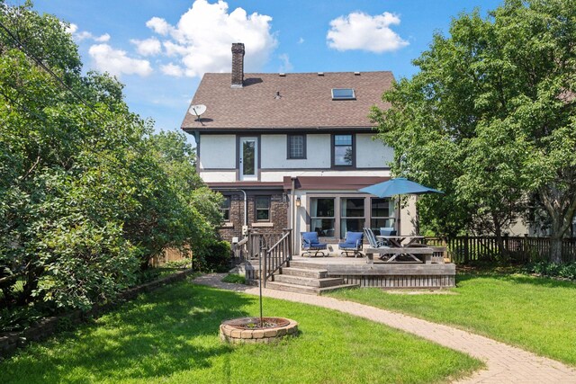 1088 Lincoln Ave, Saint Paul, MN 55105 - back of property with stucco siding, a chimney, a wooden deck, and a shingled roof