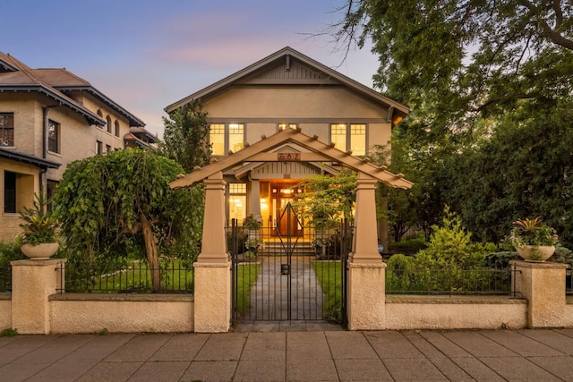 582 Summit Ave, Saint Paul, MN 55102 - view of front facade featuring a fenced front yard, a gate, and stucco siding
