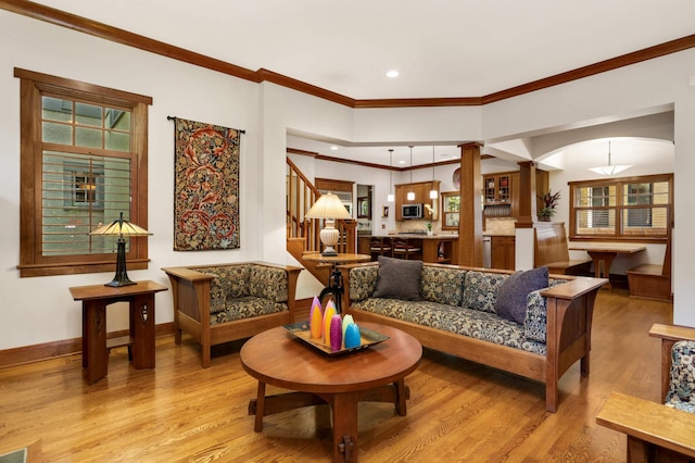 582 Summit Ave, Saint Paul, MN 55102 - living area with ornamental molding, wood finished floors, stairway, decorative columns, and recessed lighting