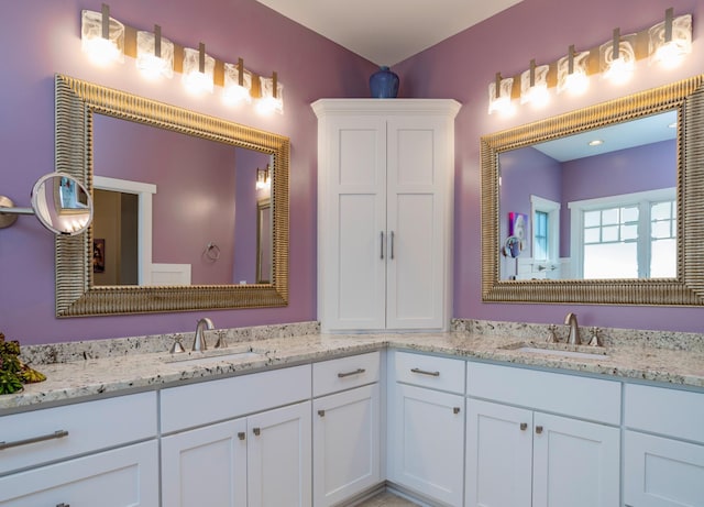 582 Summit Ave, Saint Paul, MN 55102 - bathroom featuring double vanity and toilet