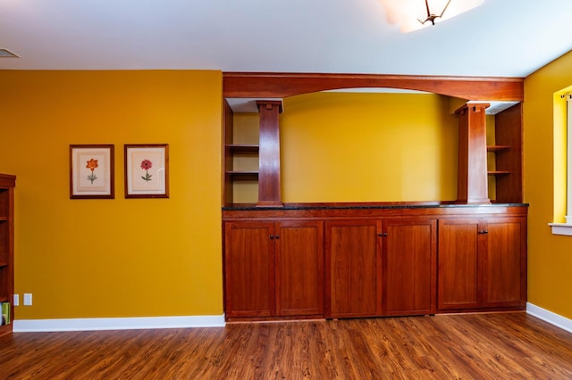 582 Summit Ave, Saint Paul, MN 55102 - unfurnished room featuring dark wood-style flooring and built in features
