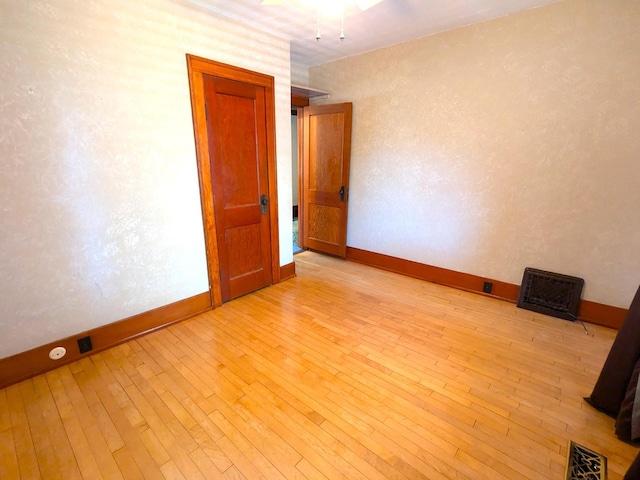 521 Chestnut St, Winona, MN 55987 - empty room with light wood-style floors