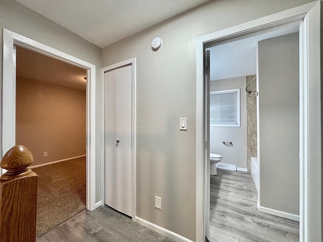 1414 Danube Rd, Fridley, MN 55432 - hallway with wood finished floors and baseboards