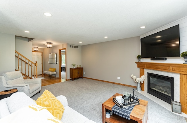 2944 Mayowood Common Cir SW, Rochester, MN 55902 - living area with stairs, recessed lighting, a fireplace with flush hearth, and carpet flooring