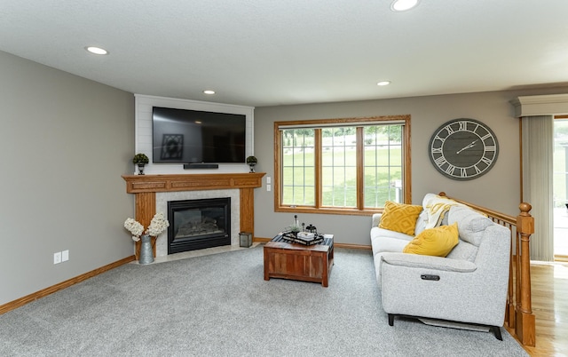 2944 Mayowood Common Cir SW, Rochester, MN 55902 - living area featuring a fireplace with flush hearth, recessed lighting, and carpet floors