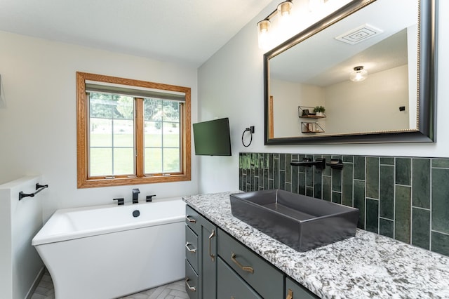 2944 Mayowood Common Cir SW, Rochester, MN 55902 - bathroom featuring a soaking tub and vanity
