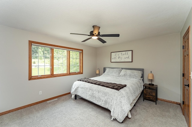 2944 Mayowood Common Cir SW, Rochester, MN 55902 - carpeted bedroom featuring baseboards and ceiling fan