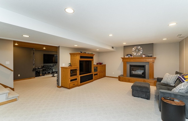 2944 Mayowood Common Cir SW, Rochester, MN 55902 - carpeted living room featuring recessed lighting, a glass covered fireplace, and stairs