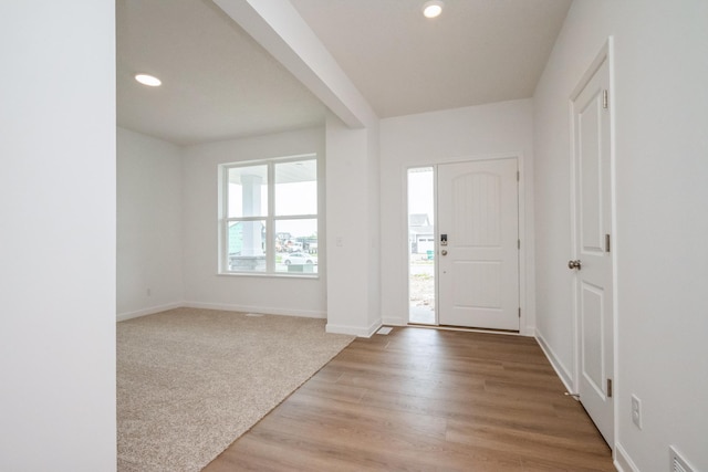 9706 Jasmine Ave NE, Hanover, MN 55341 - foyer entrance featuring recessed lighting, light wood-style floors, and light colored carpet