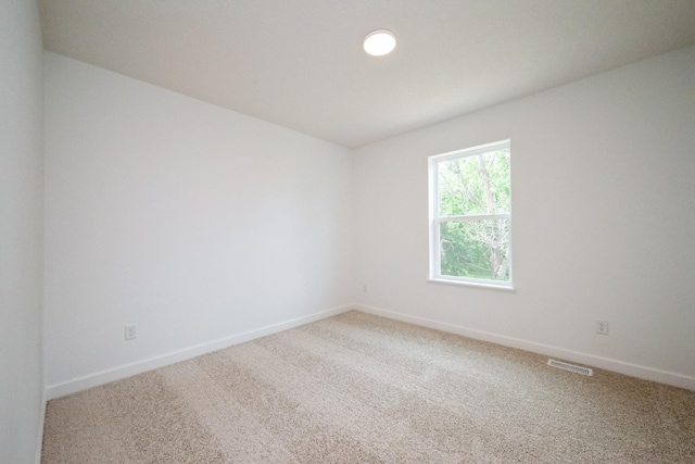 9706 Jasmine Ave NE, Hanover, MN 55341 - spare room featuring light carpet and baseboards