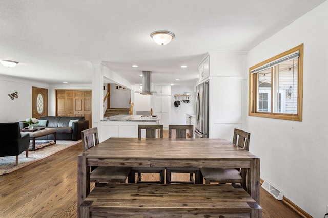 1281 Minnehaha Pkwy, Minneapolis, MN 55419 - dining room featuring wood finished floors, stairway, and recessed lighting