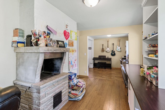 1281 Minnehaha Pkwy, Minneapolis, MN 55419 - living room featuring a fireplace with raised hearth and wood finished floors