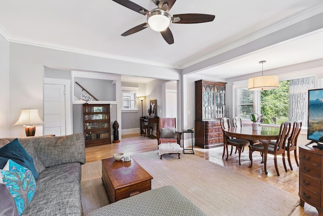 4356 Nokomis Ave, Minneapolis, MN 55406 - living area featuring ornamental molding, healthy amount of natural light, ceiling fan, stairs, and light wood-type flooring